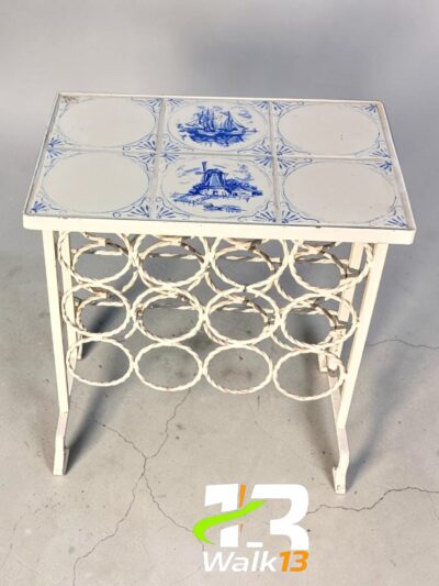 antique iron table with Delft tiles" of vintage