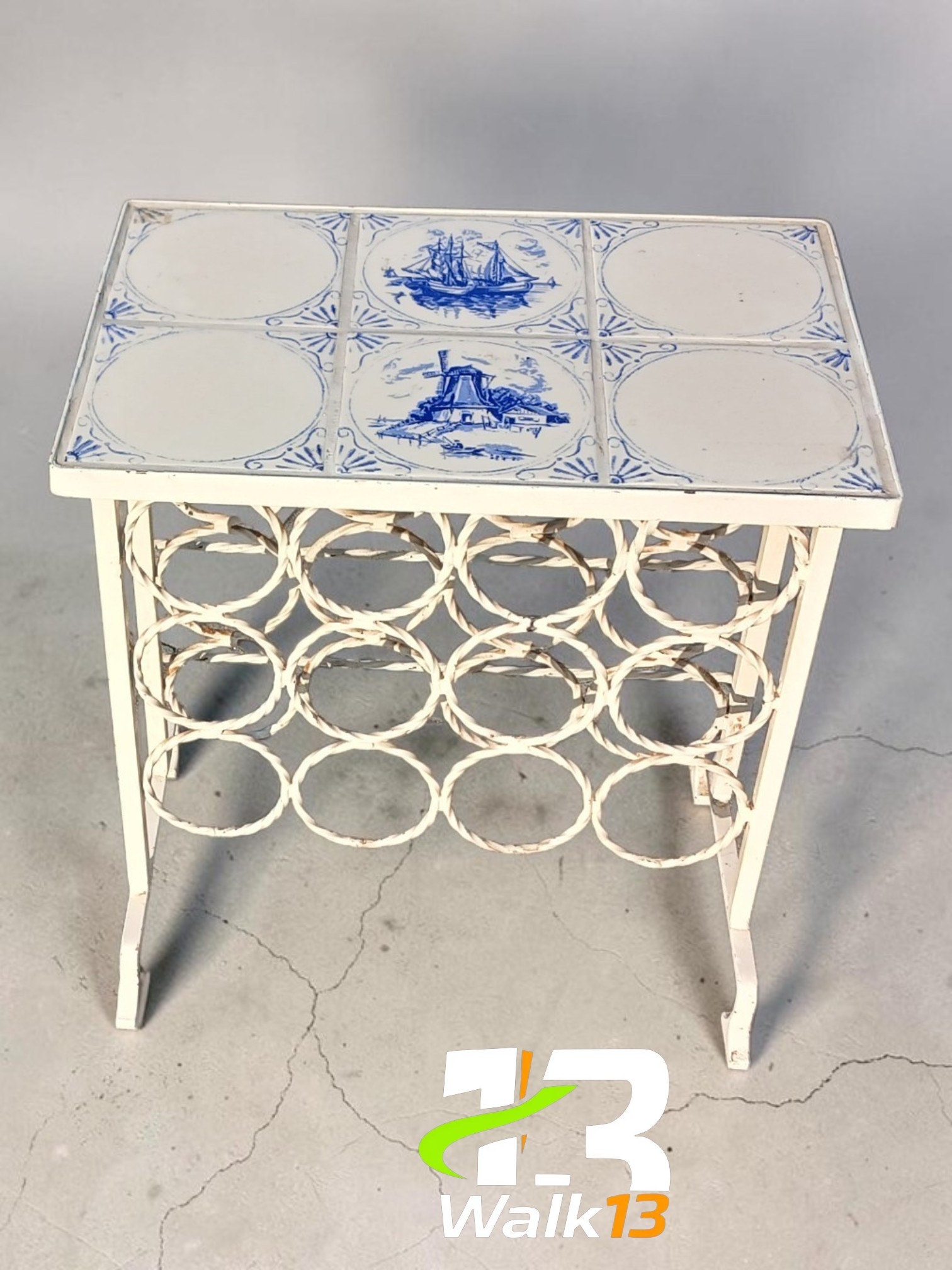 antique iron table with Delft tiles" of vintage